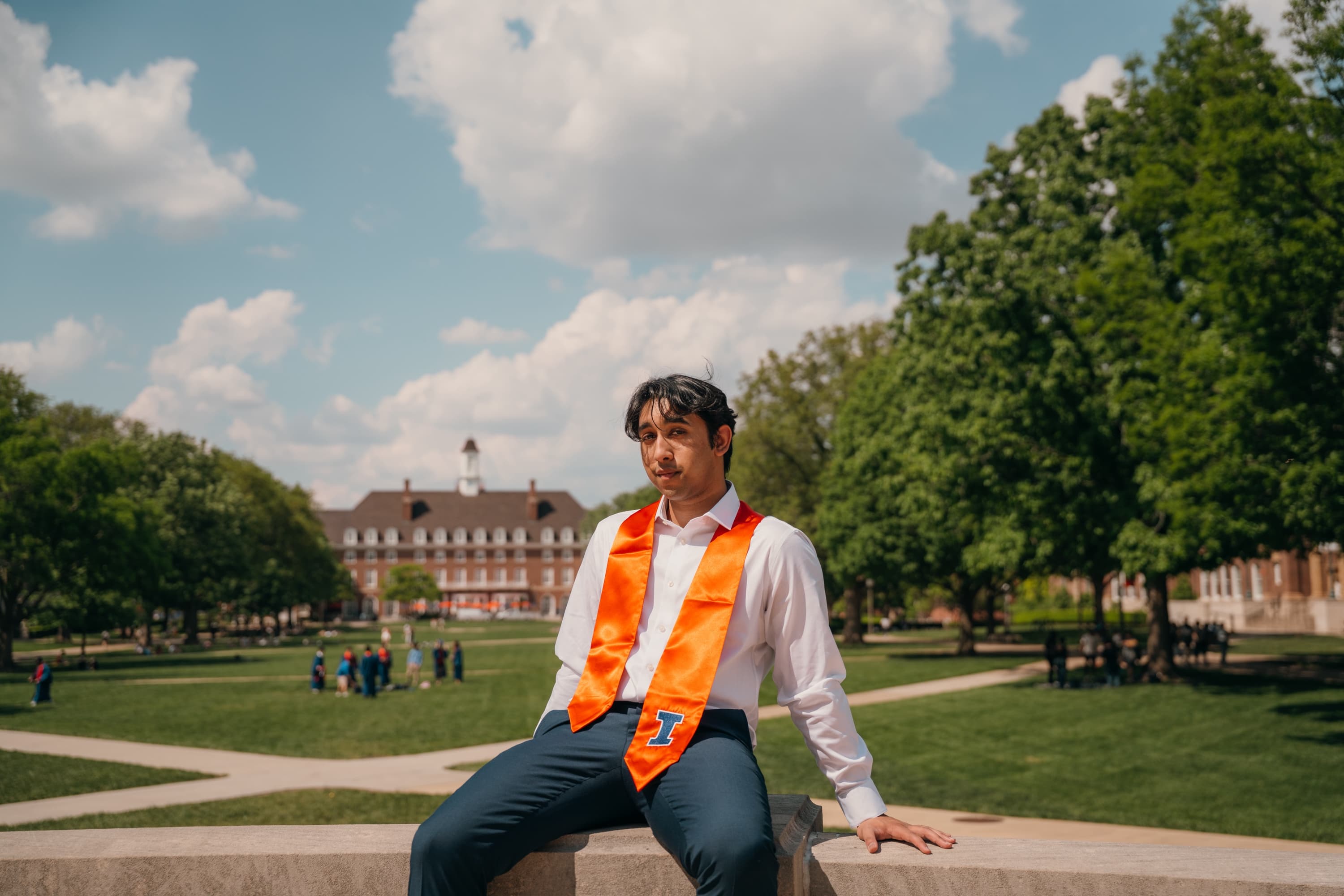 Graduate posing with cap